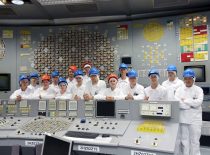 Students in the main control room of a nuclear power plant